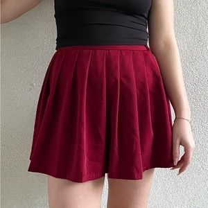 Red pleated skirt